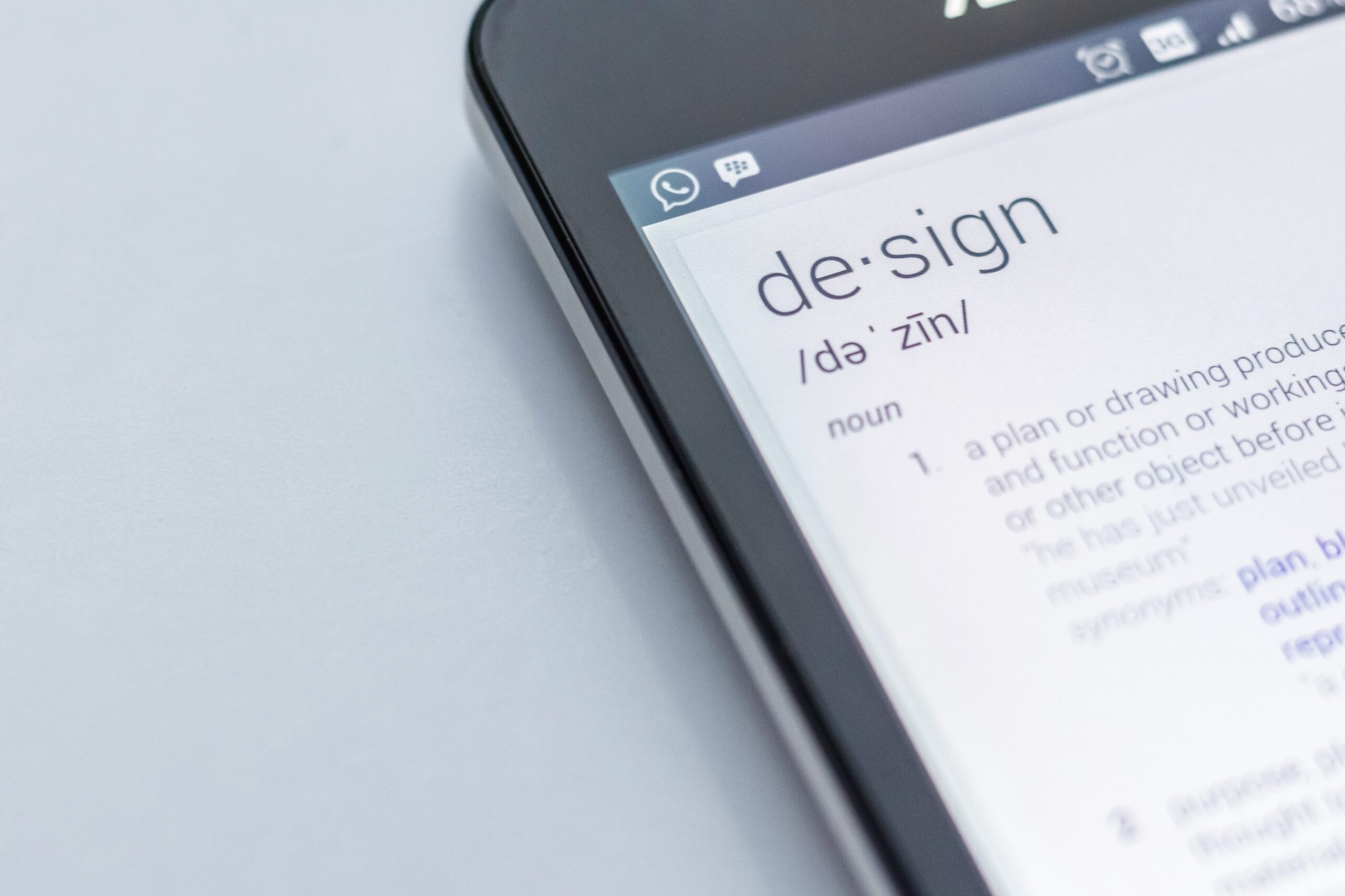 phone screen with the definition of design