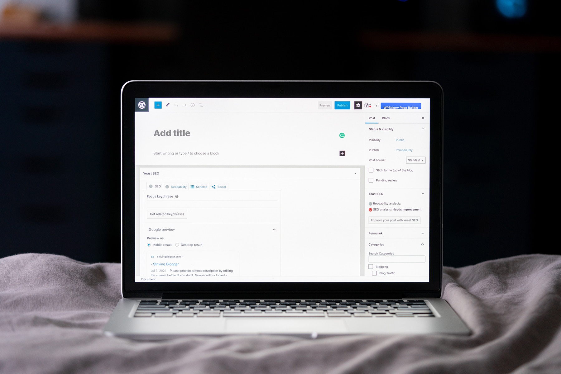 Image of laptop with an empty WordPress blog post open on the screen.